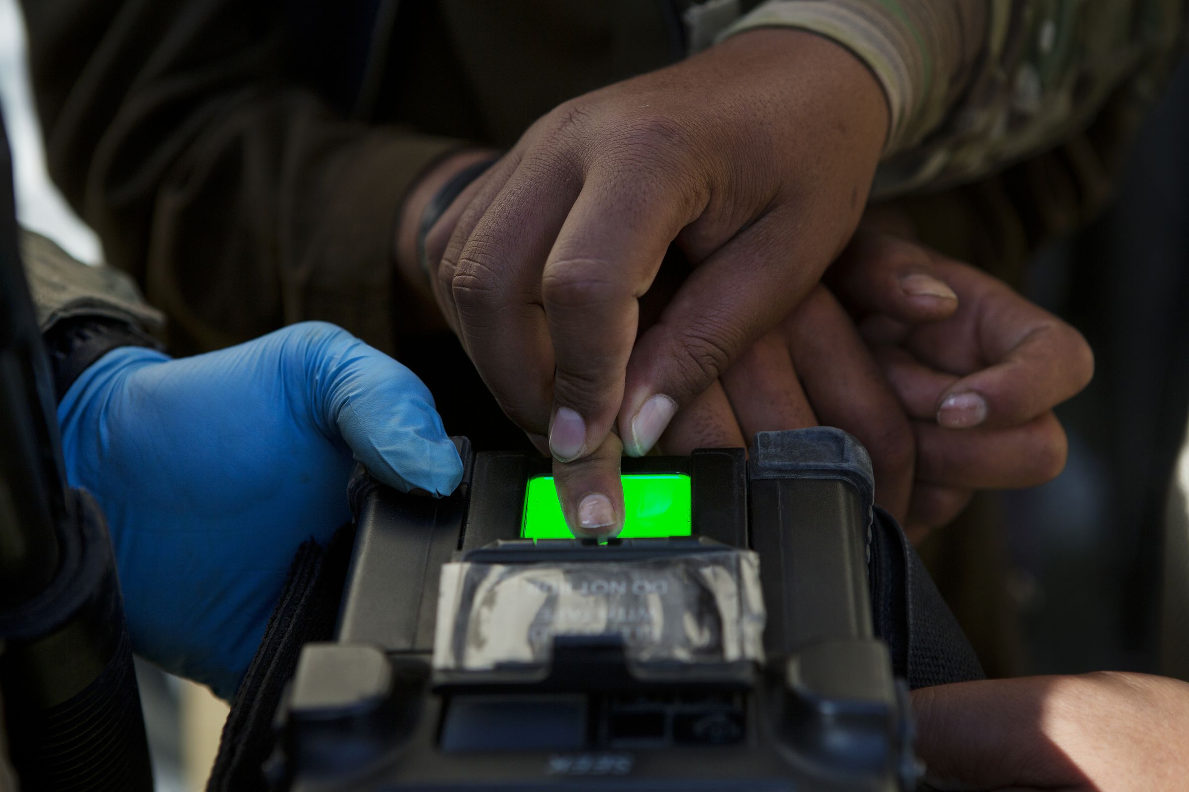 Photo of U.S. Troops In Afghanistan collecting someone’s fingerprint.